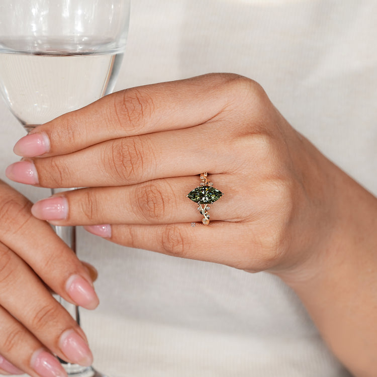 Marquise diamond ring with hidden blue topaz gemstone.