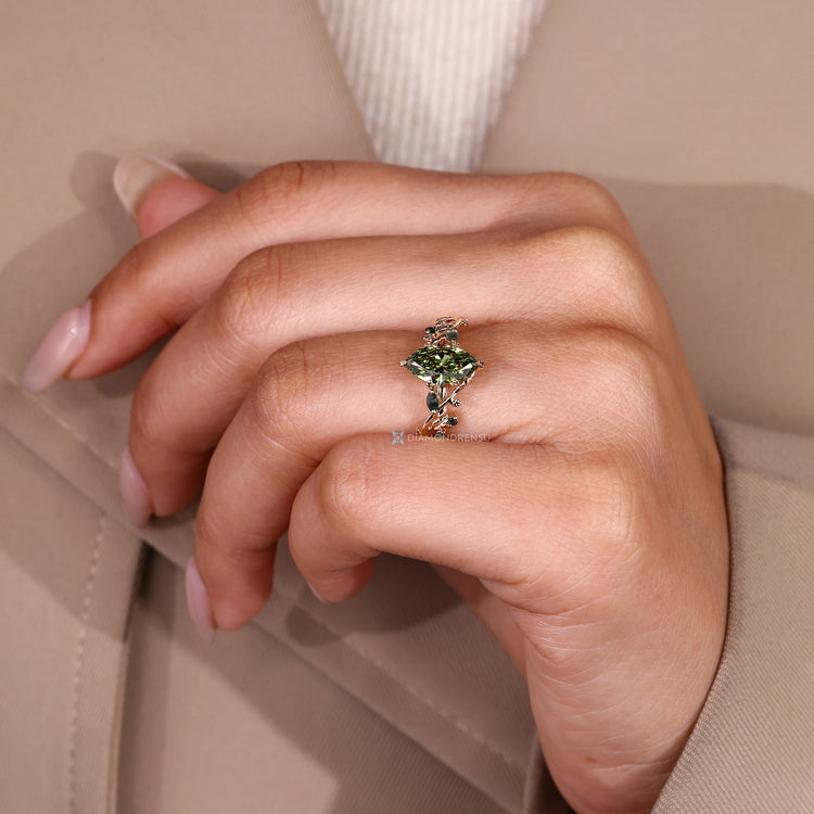 Nature inspired marquise diamond ring with leaf prongs.