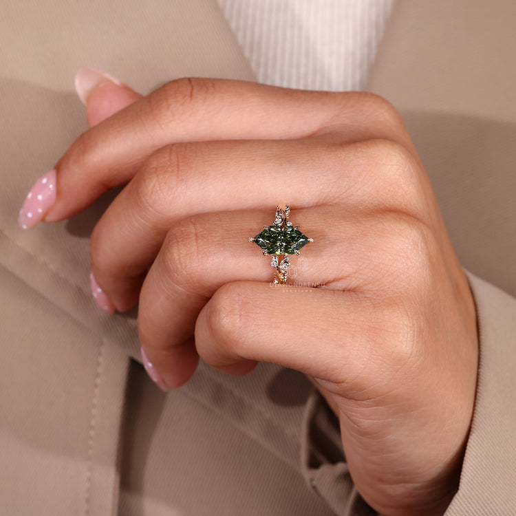 Handmade marquise engagement ring with round cut diamond accents.