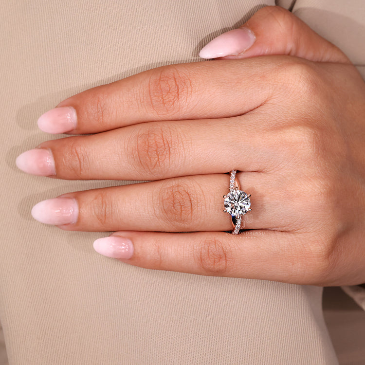 Round cut ring twisted pave round diamond style.