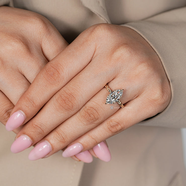 Marquise solitaire ring with flower inspired shank.