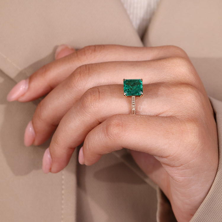 Asscher cut emerald ring handmade prong setting.
