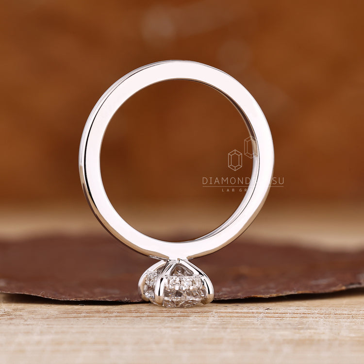 Oval engagement ring hidden halo round diamond set.