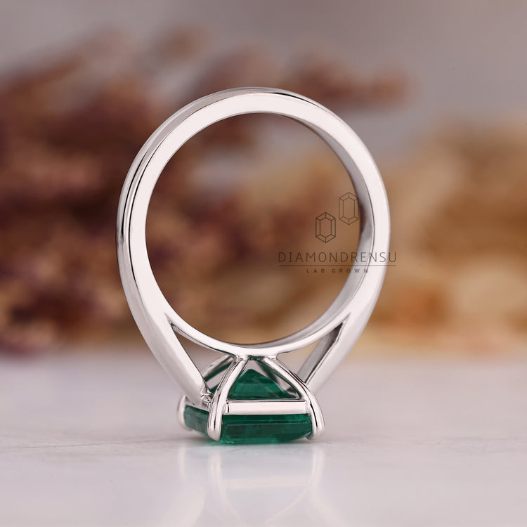Emerald gemstone ring handmade cathedral prong set.
