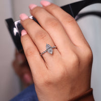 Marquise ring solitaire twisted pave prong setting.
