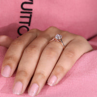 Lab grown cushion old cut ring cathedral prong style.