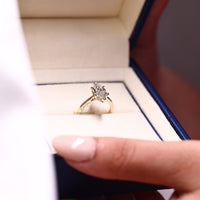 Dutch marquise ring hidden halo round diamond style.
