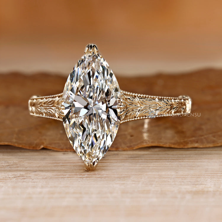 Marquise cut diamond ring with vintage milgrain design.