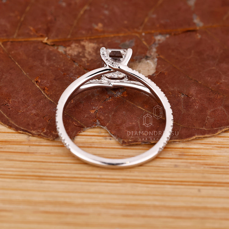 IGI certified emerald diamond ring split shank pave style.
