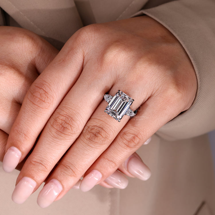 Emerald Cut Diamond Ring with round diamond halo.

