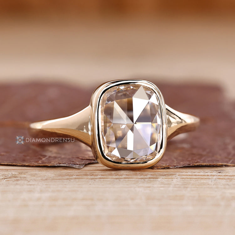 Solitaire cushion rose diamond ring bezel setting.