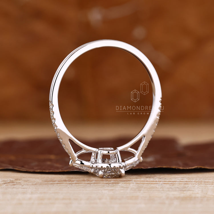 Lab grown diamond oval ring with pear side stones.
