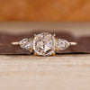 Round rose cut diamond ring with pear side stones.
