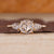 Round rose cut diamond ring with pear side stones.
