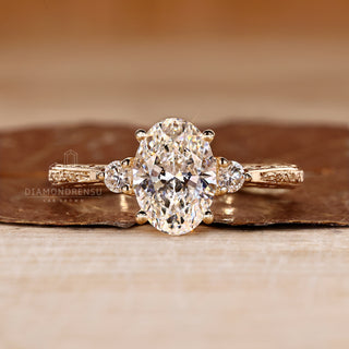 Oval cut diamond ring three stone art deco tapered shank.
