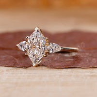 Lab grown marquise diamond ring three stone style.
