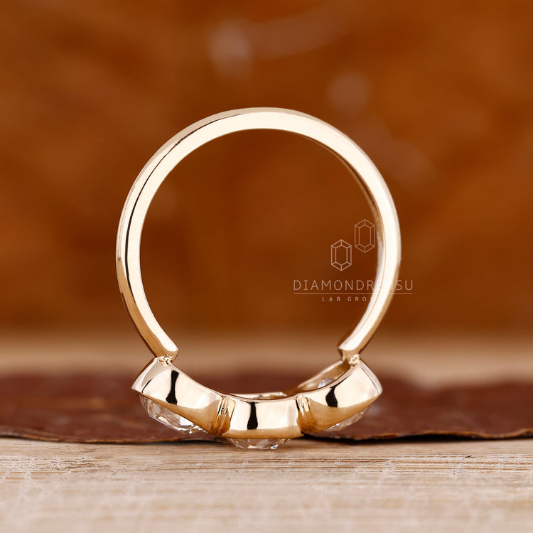 Handmade three stone Cushion Old European Cut diamond ring.
