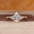 Pear cut diamond ring kite side stones art deco style.