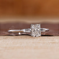 Three stone radiant diamond ring baguette side stones.
