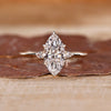 Marquise diamond ring pear side stones three stone set.

