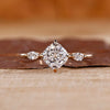 Cushion cut diamond ring marquise side stones three stone.
