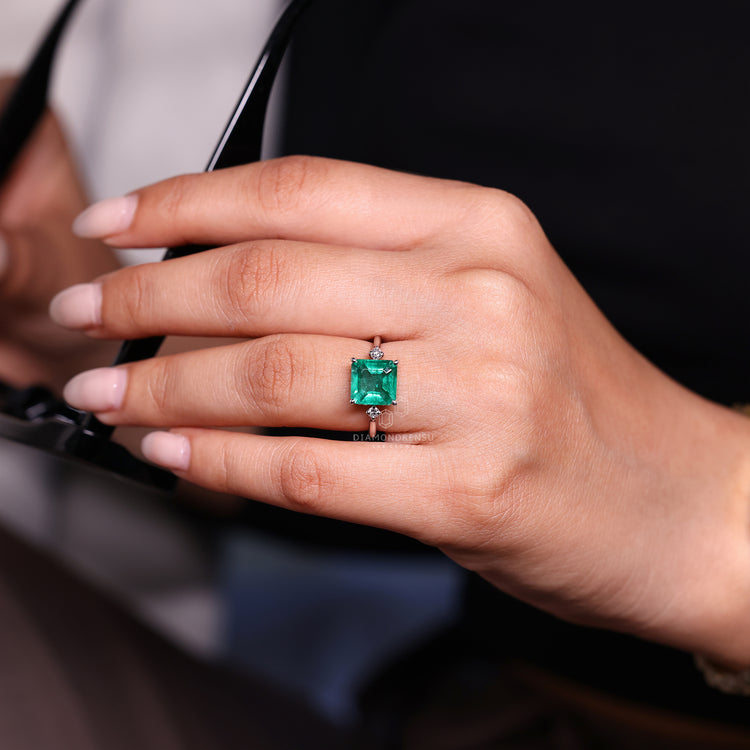 Emerald gemstone ring tapered shank open gallery set.
