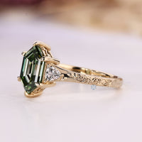 Three stone hexagon ring with trillion cut diamonds.