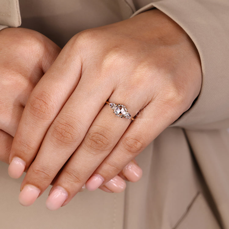 Tapered shank rose cut diamond ring with open gallery.
