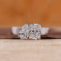Toi et Moi diamond ring with radiant and pear cut diamonds.
