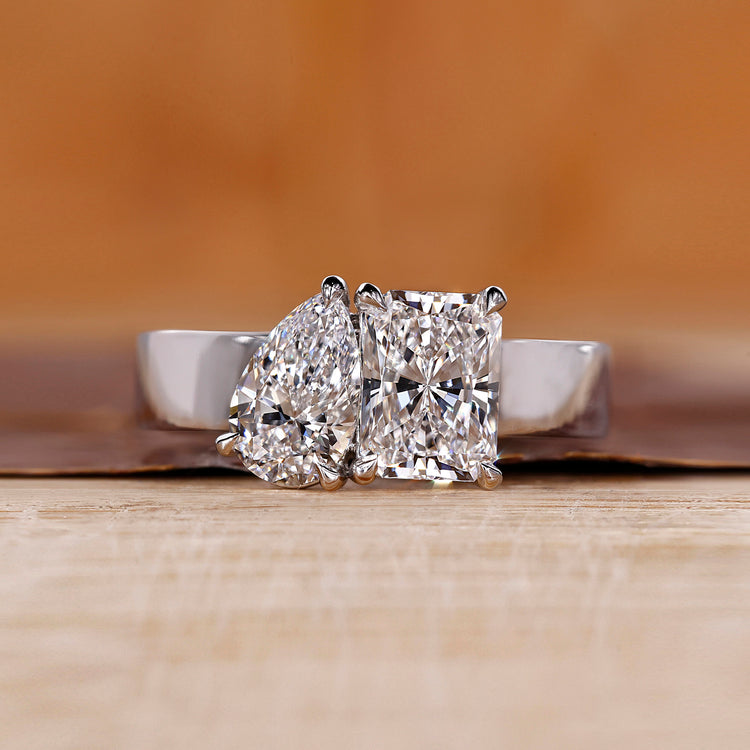 Toi et Moi diamond ring with radiant and pear cut diamonds.
