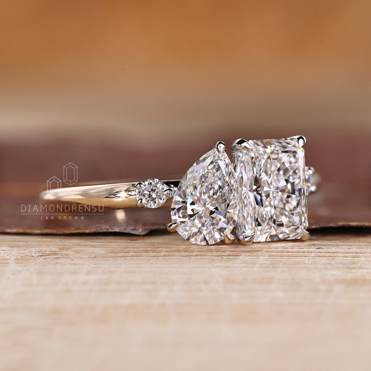 Pear radiant cut ring two stone claw prong setting.
