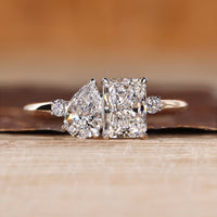 Pear and radiant cut ring toi et moi split shank style.
