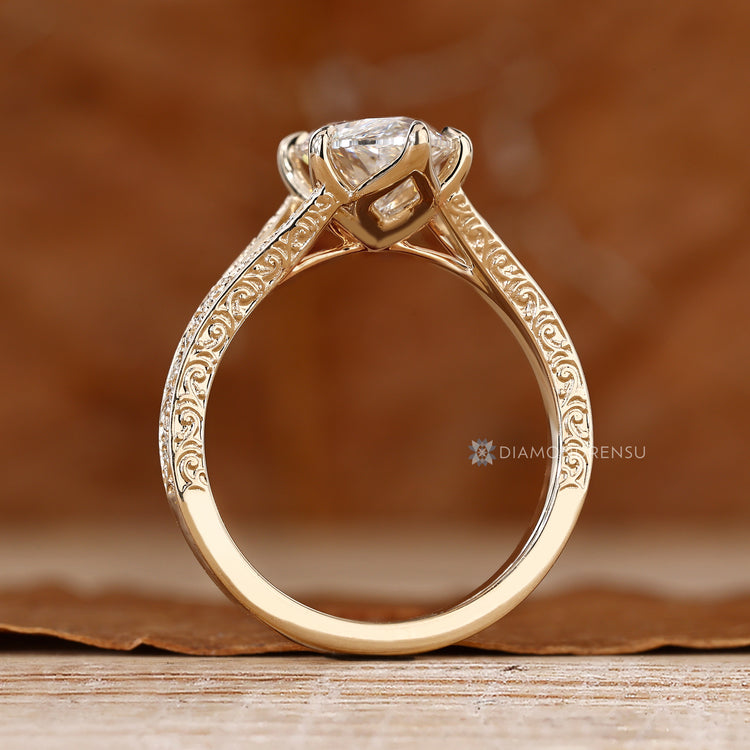 Marquise ring with tulip basket and cathedral setting.