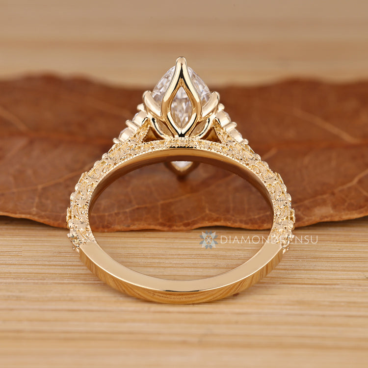 Marquise diamond ring with Art Deco inspired details.