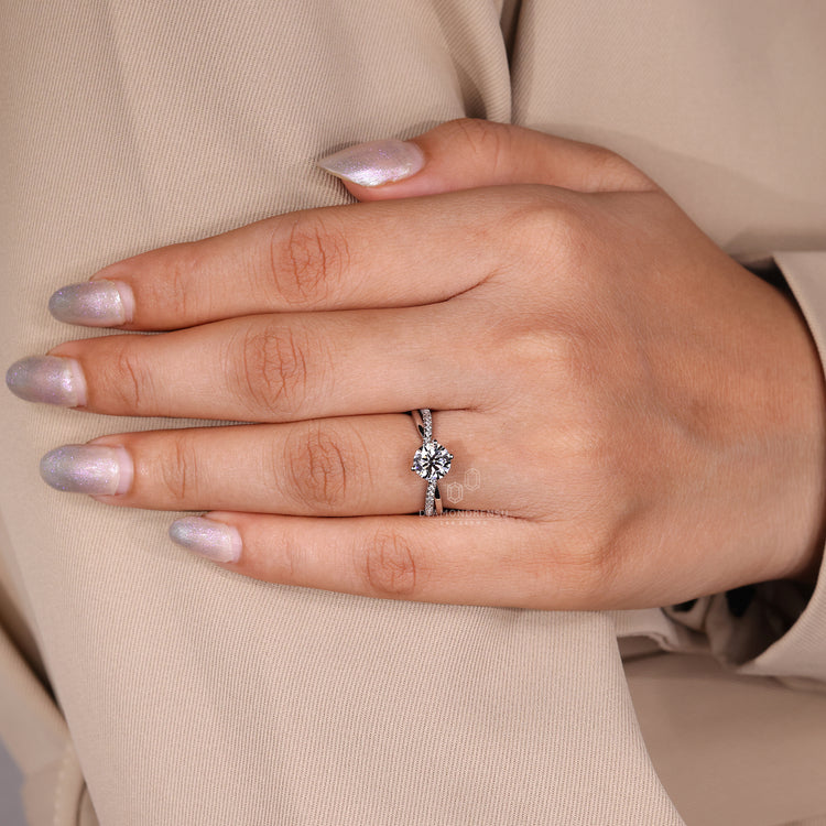 Round cut diamond ring IGI certified twisted pave.
