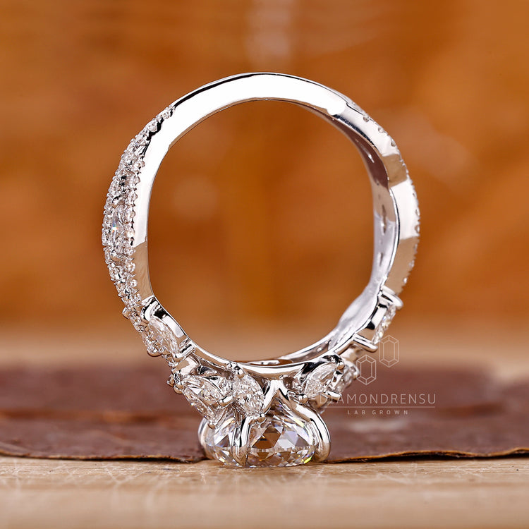 Portuguese ring marquise stones prong pave setting.