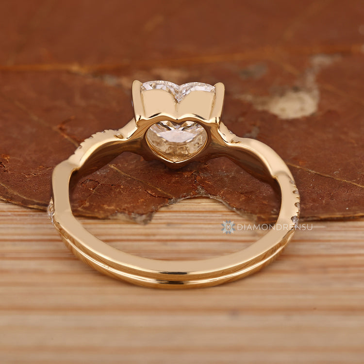 Handmade heart cut diamond ring with pave style.