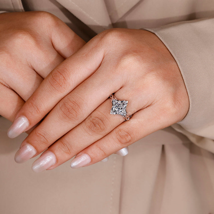 Lab grown diamond marquise ring with side stones.
