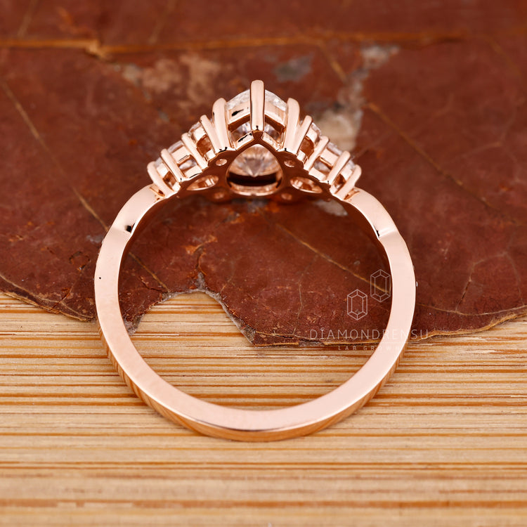 Pear diamond ring muse setting marquise pave style.