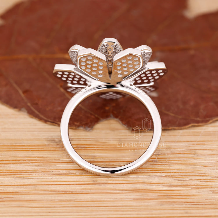 Vintage diamond ring with round diamond accents.
