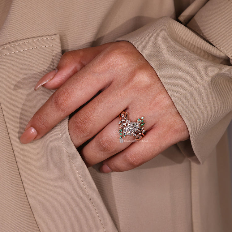 Dutch marquise set with green emerald gemstones.