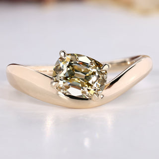 Old mine cushion cut diamond ring with east to west setting.