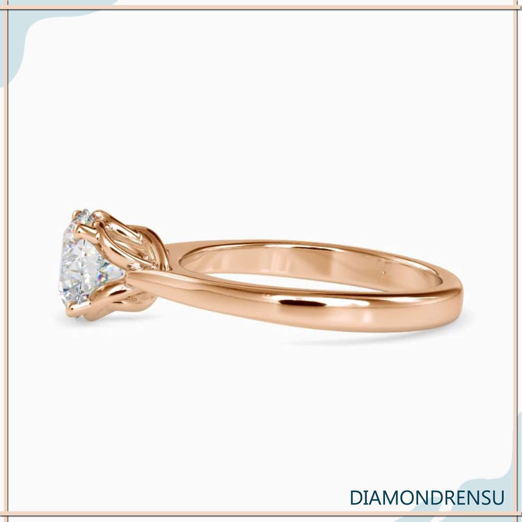 2 ct solitaire diamond engagement ring in a stunning twisted prong basket setting.