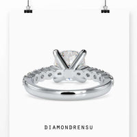 Engagement ring oval cut diamond in a split shank and halo setting
