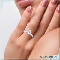 Stunning knife edge ring featuring a round cut diamond for extra sparkle.