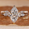 Marquise diamond bridal set with round side stones.