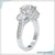 Three stone engagement ring with a classic round cut diamond center.
