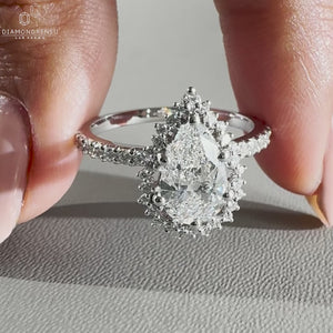 round cut diamond halo ring with White gold band.
