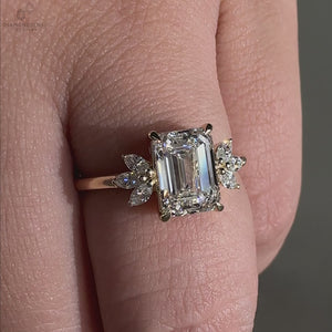 Handmade emerald cut engagement ring in yellow gold.
