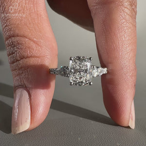 3 Stone Diamond Engagement Ring with pear side stone ring.
